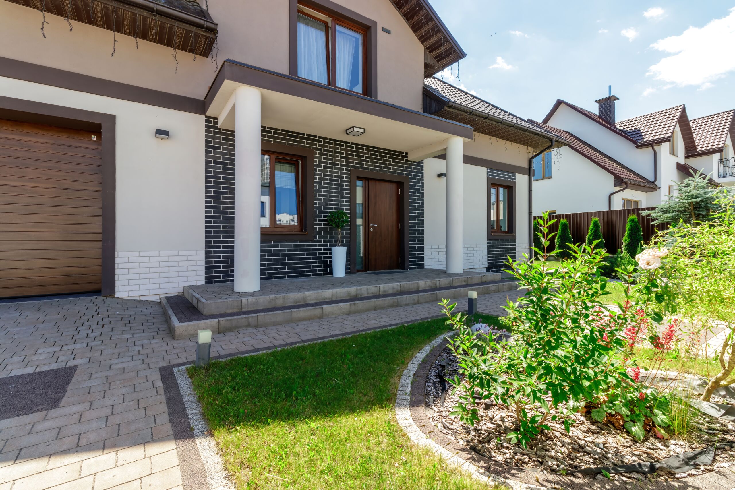 Modern Family Home with Brick Accents and Stylish Pathway